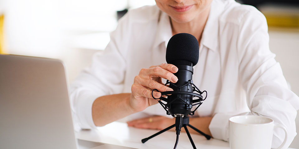 woman talking into a microphone